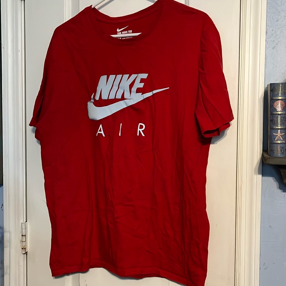 The NIKE Tee, Athletic Cut size Large red t-shirt.